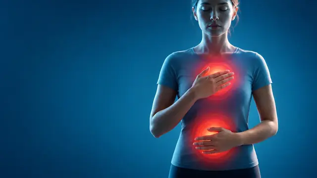 Mulher com as mãos no peito e na barriga, com áreas destacadas em vermelho indicando tensão